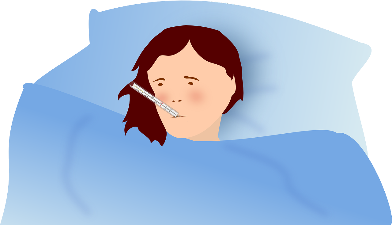 Person in bed with a thermometer in their mouth