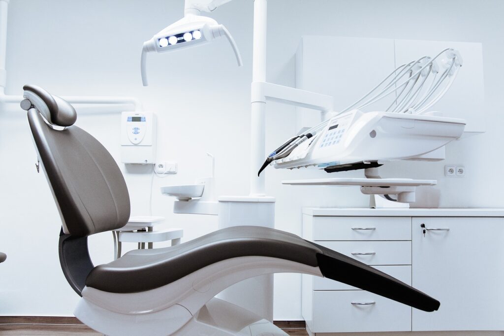 A white, clean, bright dental office with a modern style dental chair